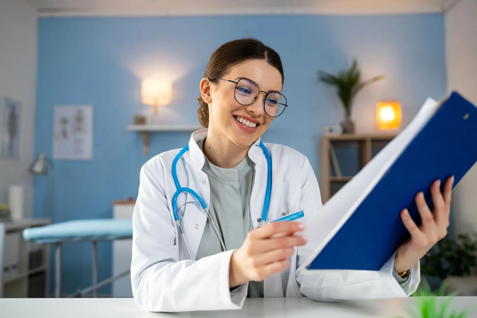 U.S. physician reviewing patient chart notes in a clinical office
